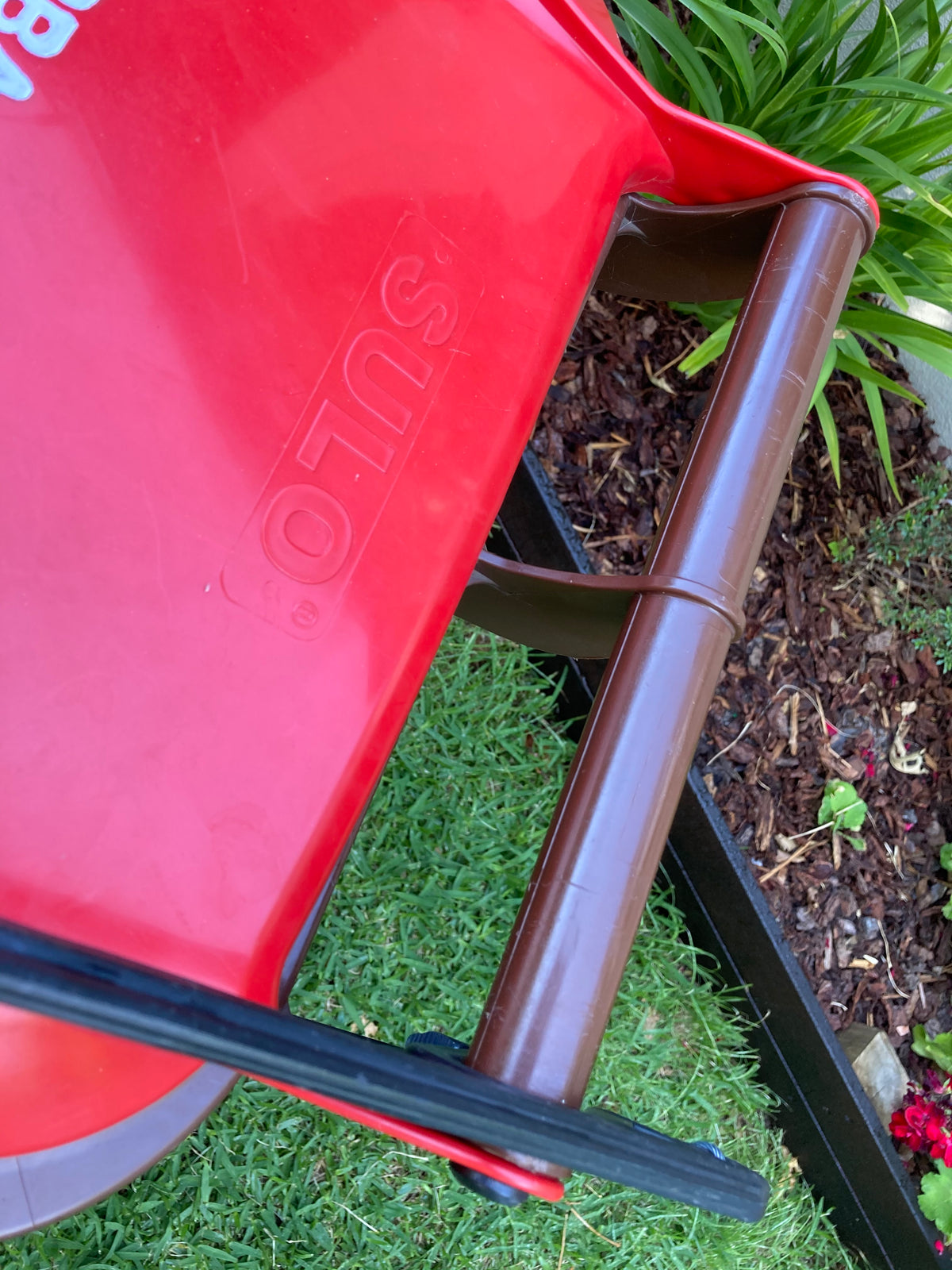 Close up of BLIP bin lid opener on lid of bin